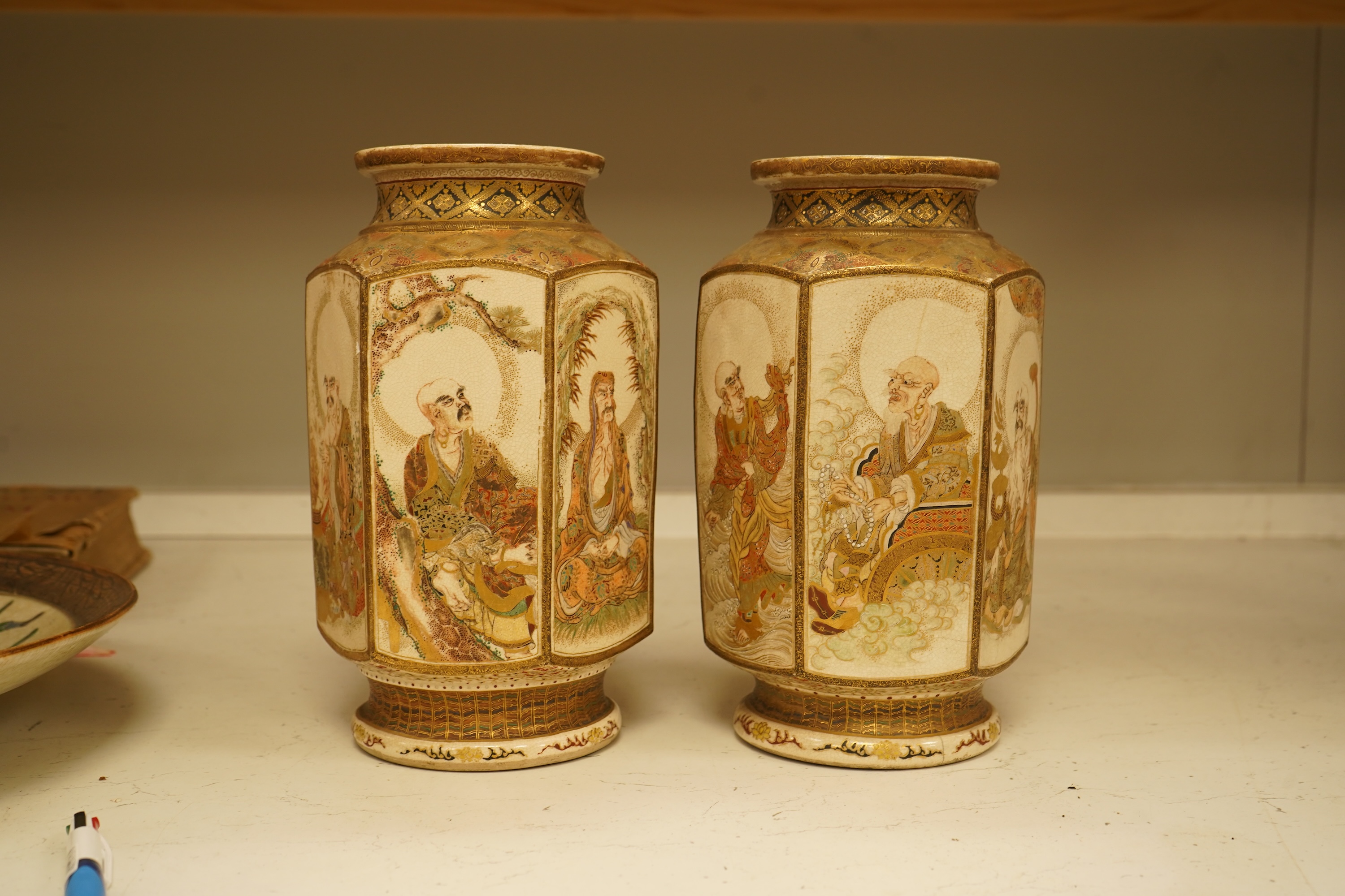 A pair of Japanese Satsuma 'rakan' vases, Meiji period, 26cm high